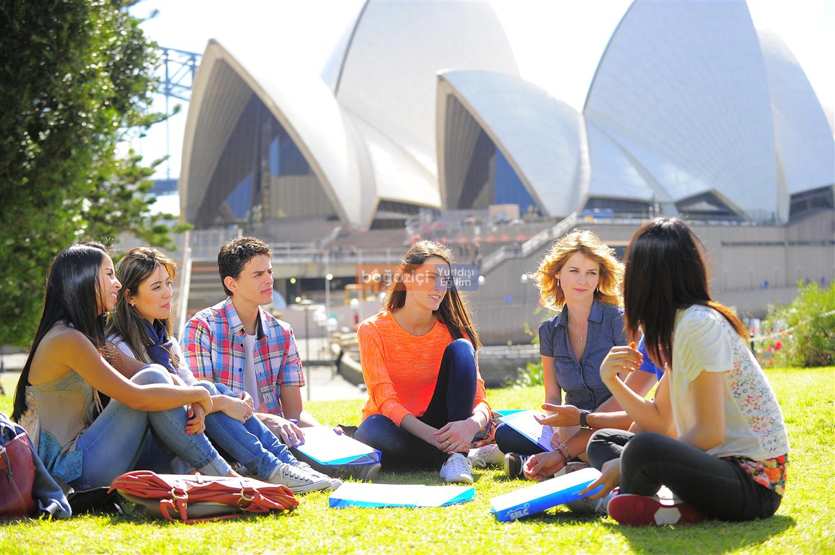 group with opera house behind